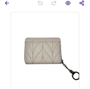Kate spade small wallet with key chain attachment. Cream color NWOT